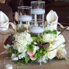 Orchids Cute For The Small Round Tables Centerpieces With Images Floating Candle Centerpieces Flower Bouquet Wedding Candle Centerpieces