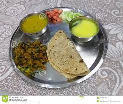 Photo About Indian Served Thali Platter Meal Containing Bowl Of Legumes Salad Vegetable Mix And Roti Bread Image Of Thali Ser Roti Bread Food Vegetable Mix