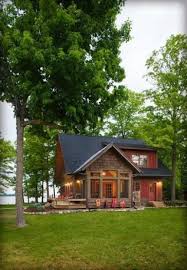 The foyer views extend to the rear of the house and it has a loft above that provides views to the family room and out the rear windows. Small Lake House Designs