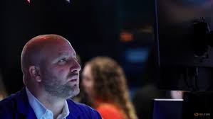 Wall St closes higher ahead of Fed; crude tumbles