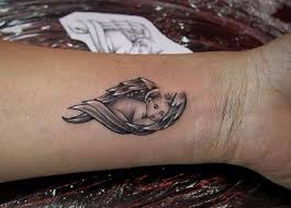 Small fallen angel tattoo on back shoulder. 140 Heavenly Angel Tattoos That Will Make You Believe