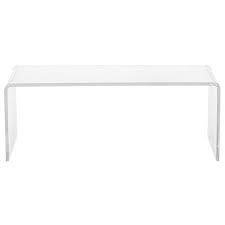This transparent new surface floats in the room without taking up permanent visual residency. Cb2 Peekaboo Acrylic Coffee Table Copycatchic