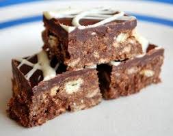 With a smashed tea biscuit crust and a cream cheese filling, this colorful tart is sure to keep you satisfied. Two Simple Chocolate Traybakes Made For Village Royal Wedding Tea Party Rich Tea Biscuits Tray Bake Recipes Tray Bakes