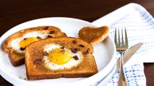 Put 2 tablespoons of sunflower oil into a baking tin, then place on the middle shelf of your. The Ambiguous History Of Egg In A Hole Eater