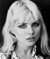 Clem Burke photographed with Debbie Harry as they walk down 14th Street in  Manhattan in 1976. Photo by Chris Stein. 📸