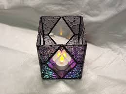 Creating stained glass effects with glass paint is a simple hack that looks gorgeous. Stained Glass Candle Holder Patterns Candle Holders Stained Glass Candles Stained Glass Candle Holder Patterns Stained Glass Candle Holders