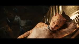The cat is seeking the attention of a little girl. Who Are The Cats In The Cats Movie And Which Ones Look The Weirdest