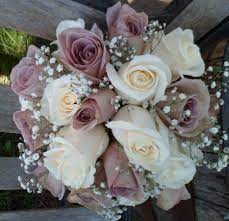 | / looking for pink cream artificial wedding flowers? Bridal Bouquet Amnesia And Cream Colored Roses With Baby S Breath Wedding Bridesmaid Bouquets Wildflower Wedding Bouquet Flower Bouquet Wedding