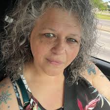 Remove seatbelt and jacket stripe from author photo?