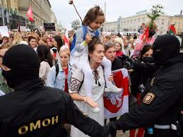 Women in belarus take protests into their own hands women wearing white and waving flowers take part in a procession against police violence in minsk. Watch Belarusian Women Burst Through A Police Cordon At Minsk Protest