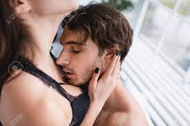 Passionate Man Kissing Breast Of Sexy Woman Stock Photo, Picture and  Royalty Free Image. Image 169181113.