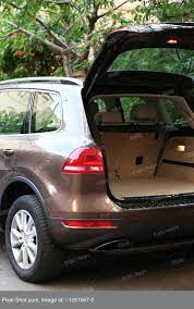 Sometimes used cars are purchased from individuals rather than dealerships, which can require more of the buyer's participation in the process of transferring the ti. Open Trunk Of Car Outdoors Stock Photography Agency Pixel Shot Studio