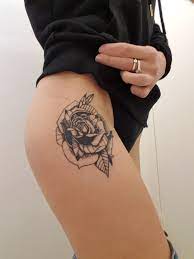A reasonably sized rose tattoo can also look great on the chest, upper back and even foot. Rose Tattoo Dot Work Upper Thigh All Black Rose Tattoo Tattoos Flower Tattoo