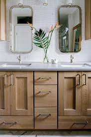 White painted bathroom vanity unit with oak top basin sink & tap. A Refined Rustic Master Bathroom With A Quarter Sawn White Oak Vanity And A Concrete Look Silesto Oak Bathroom Vanity Rustic Master Bathroom Concrete Interiors