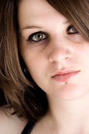 File:Woman with hazel eyes and labret piercing gazes at the camera.jpg