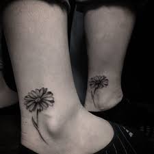 Daisy tattoo designs & their meaning. The Daisy Tattoo Meaning With Elegant Artwork Tattooswin