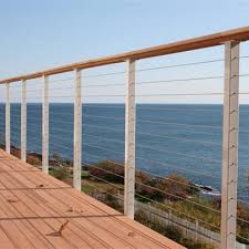 The material forms a slim net look that pairs with wood posts nearby. China Stainless Steel Cable Railing Wire Rope Balustrade Design China Stainless Steel Balustrade Stainless Steel Cable Railing