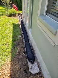 It consists of a perforated pipe surrounded by gravel and lined with sturdy landscape fabric. Tampa Drainage Contractors Gutter Installation Repair Lre