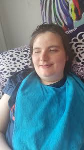 Is anybody able to zoom into this picture with a making it look bad and  tidy up the background? One of the last pictures I have of my mum before  dementia took