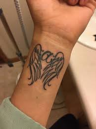Painted angel wings tattoo right side view/caption. Best Angel Wings Tattoo Designs Meanings Tattoos Spot