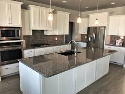 White Cabinets With A Stunning Azul Platino Granite Countertop Kitchencounter Granite Countertops Kitchen Black Granite Countertops White Granite Countertops
