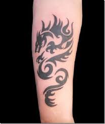 Whether you want small and simple, colorful or black and white ink, this gallery of the best dragon tattoos for guys will provide inspiration for your next piece. 55 Awesomest Tribal Tattoo Designs For Males And Ladies Dragon Tattoos For Men Tribal Tattoos Tribal Tattoos For Men