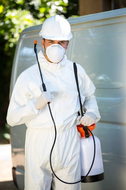 Technician preparing eco-friendly pest control equipment