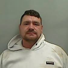 Boyfriend punched partner, drove her car into garden wall then headbutted  police officer