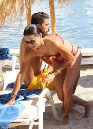 The german star was spotted holidaying in mykonos with victoria's secret angel in july 2016. Adriana Lima Sizzles In A Red Bikini On A Mykonos Beach With Sami Khedira Daily Mail Online