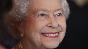 Thrilled' Queen smiles at first engagement since royal birth