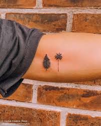 Pine Tree And Palm Tree Tattoo On The Inner Arm In 2020 Palm Tree Tattoo Tree Tattoo Tattoos