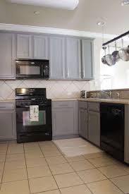 Black Appliances With Grey Cabinets Fashionable And Sophisticated Kitchen Black Appliances Black Appliances Kitchen Kitchen Cabinets With Black Appliances Kitchen Design Decor