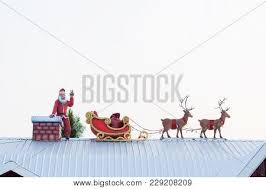 Santa and reindeer for roof. Santaclaus Reindeer On Image Photo Free Trial Bigstock
