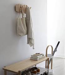 19 Modern Functional Entryway Wall Racks Vurni Mudroom shoe organization ideas with black tiles flooring and above it, a colorful carpet. modern functional entryway wall racks