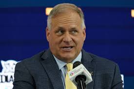 Why does Rich Rodriguez enjoy coaching so much?