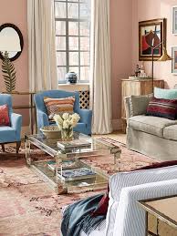 The matted ambiance in this bohemian chic living room is dashingly chic and beautiful. This Sitting Room Is Filled With Natural Light Further Enhanced By The Warm Pale Pink Walls Living Room Color Schemes Pink Living Room Walls Pink Living Room