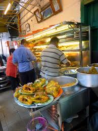 Line clear is located in a narrow alleyway along jalan penang, with wooden tables and chairs, slightly near open drains. Penang Food For Thought Line Clear