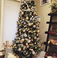 So, you will deviate from the red, green and gold colors but it is best to retain white. Black And White And Gold Christmas Tree Gold Christmas Decorations Christmas Themes Decorations Gold Christmas