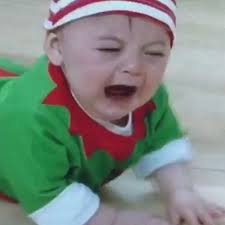 Baby in elf outfit is livid he has to compete in baby race during game
