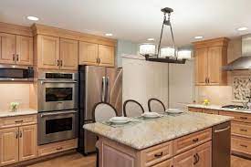 Just like the cut outs can be accessed from both sides, the three drawers open in both directions too! Contemporary Kitchen With Light Wood Cabinets And Kitchen Island Hgtv