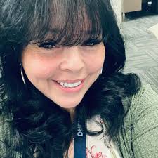 A makeshift memorial and flowers lay at the spot where a nearly 14-foot  alligator was found with human remains in its mouth. Now, the victim's  daughter is honoring her mother by acknowledging