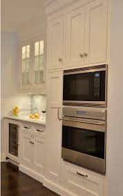Kitchen Cabinet Ideas Next To The The Oven And Microwave A Tall Broom Cabinet Houses Cleaning Gear Kitchen Interior Home Kitchens Kitchen Furniture Storage