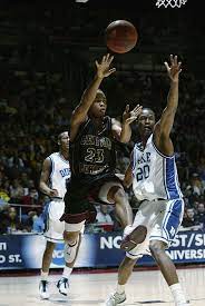 Joe Carr Of Central Michigan Passes The Ball In Front Of Casey Central Michigan Michigan Casey