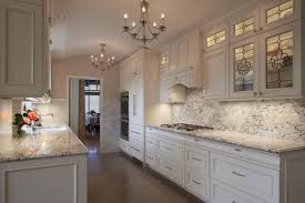 Elegant Kitchen With White Cabinets And White Ice Granite Countertops White Cabinets White Countertops Cheap Granite Countertops White Granite Countertops