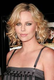 Side parts are always very stylish and at least chin length bobs with or without curls look stunning on charlize. How To Get 40s Curls With A Curling Iron Charlize Theron Hair Charlize Theron Style Charlize Theron