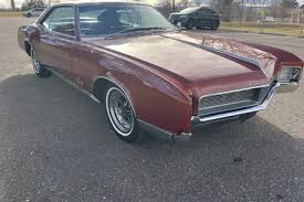 Image result for Riviera Red 1966 Buick