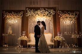 I Like The The Falling Flower Effect On The Gold Frames Wedding Stage Backdrop Wedding Stage Wedding Reception Backdrop