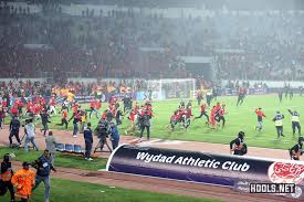 Wydad casablanca in international football. Wydad Fans Storm Pitch As They Crash Out Of Arab Club Champions Cup