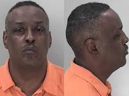 Georgia man charged with killing wife in front of children