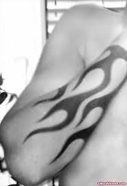 Dragon and flame tattoo on chest and shoulder. Black Ink Fire And Flame Tattoo On Right Forearm